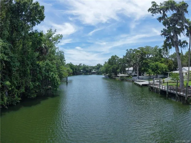 a view of lake with green space