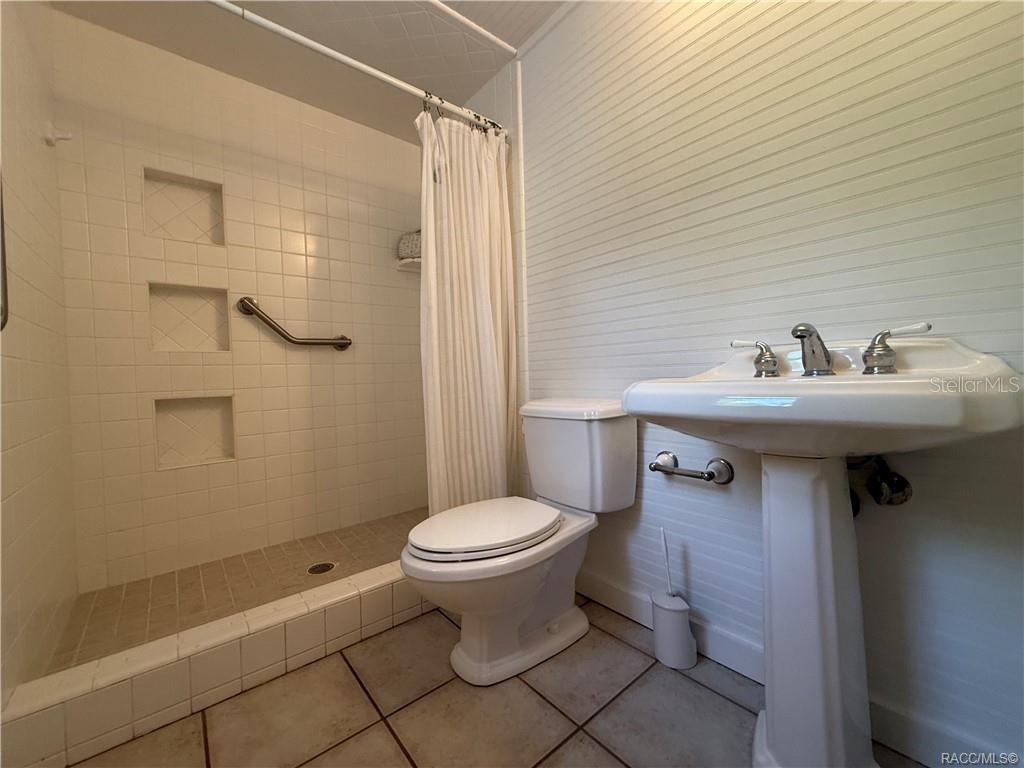 5217 Riverside Drive Yankeetown, FL 34498 - Photo 35 of 54 a bathroom with a sink toilet and shower