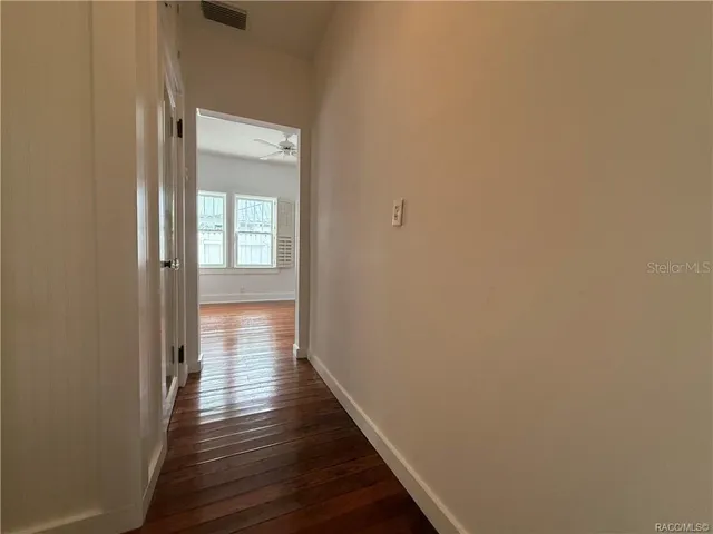 a kitchen with a stove and cabinets
