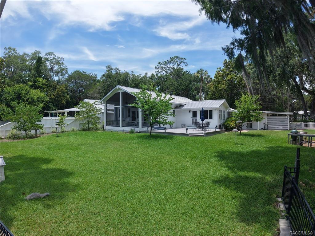 5217 Riverside Drive Yankeetown, FL 34498 - Photo 4 of 54 a view of a house with backyard and garden