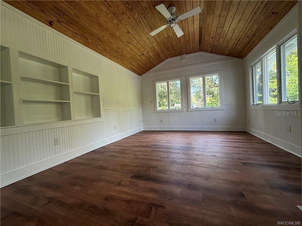 5217 Riverside Drive Yankeetown, FL 34498 - Photo 45 of 54 an empty room with wooden floor and windows