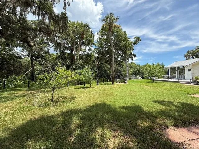 an aerial view of a house with lake view