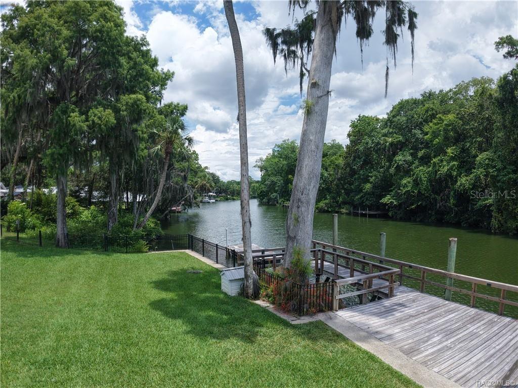 5217 Riverside Drive Yankeetown, FL 34498 - Photo 6 of 54 a view of a chair and table in the garden