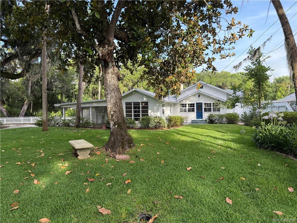 5217 Riverside Drive Yankeetown, FL 34498 - Photo 8 of 54 a front view of a house with garden