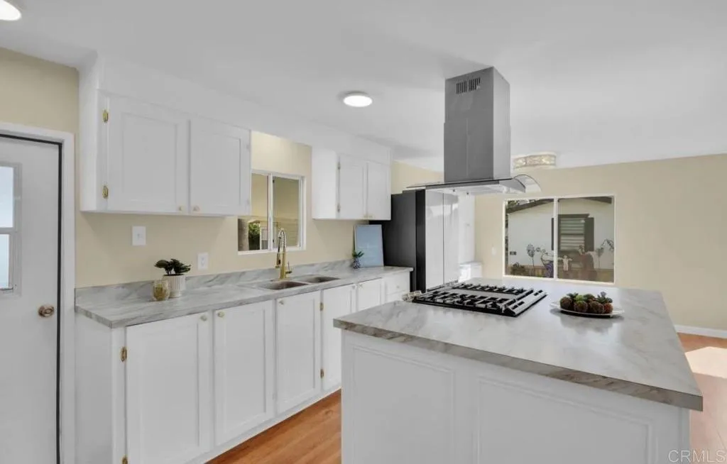 2515 Sweetwater Road, Unit 32 Spring Valley, CA 91977 - Photo 6 of 11 a kitchen with stainless steel appliances granite countertop a sink stove and refrigerator