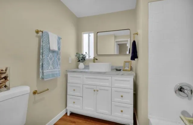 a bathroom with a double vanity sink and mirror