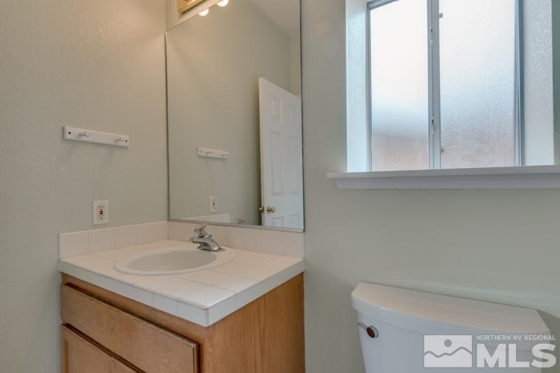 2635 Emily Street Reno, NV 89503 - Photo 12 of 23 a bathroom with a sink and a toilet
