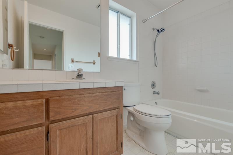 2635 Emily Street Reno, NV 89503 - Photo 19 of 23 a bathroom with a sink toilet vanity and shower
