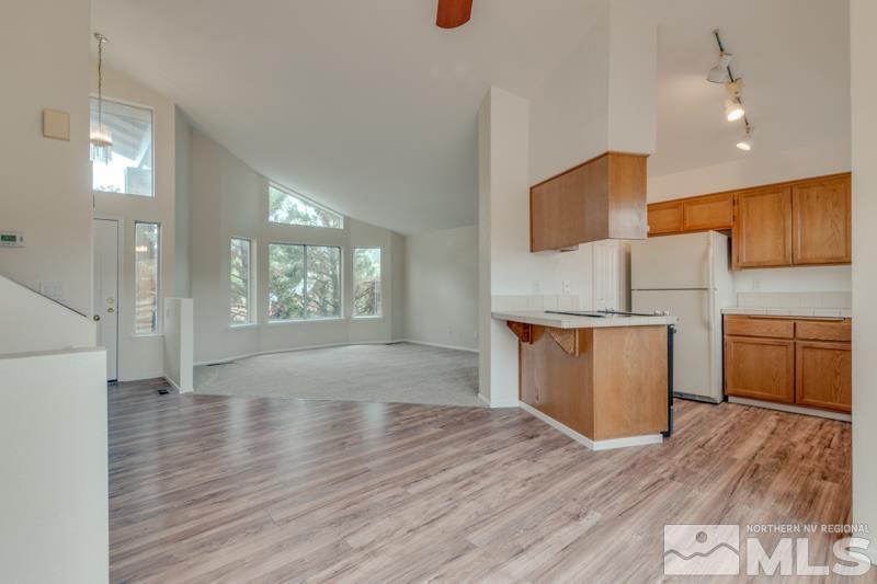 2635 Emily Street Reno, NV 89503 - Photo 8 of 23 a kitchen with wooden floors and wooden cabinets