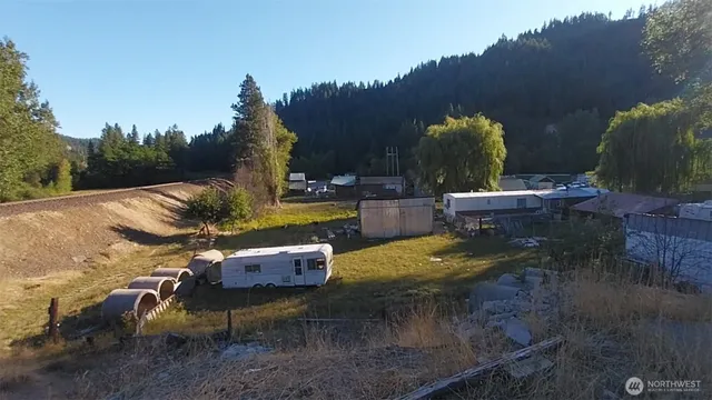 a view of backyard with swimming pool and outdoor seating