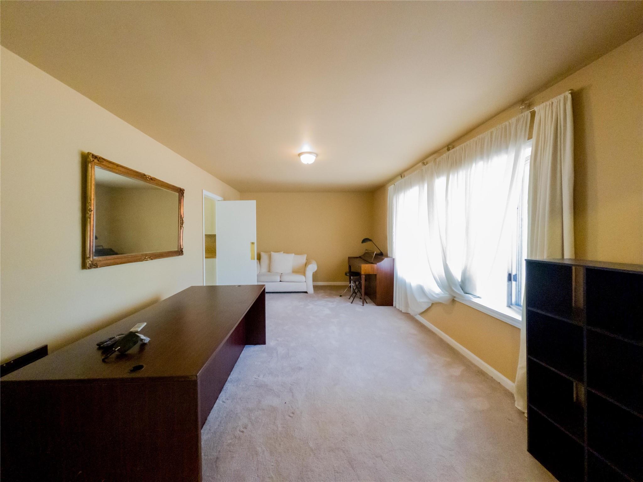 4910 Lakeview Road Charlotte, NC 28216 - Photo 12 of 26 a bed room with a bed and a window