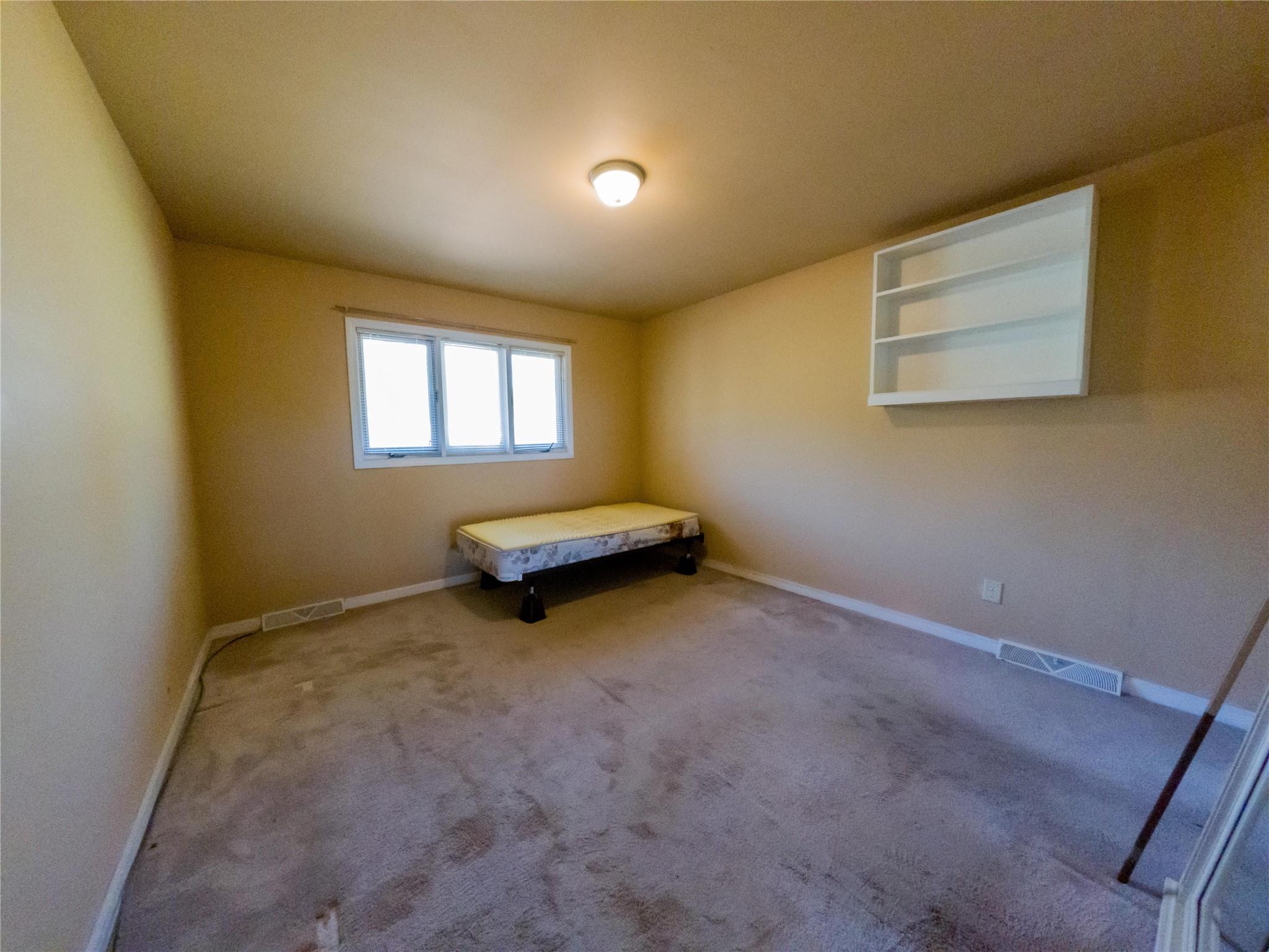 4910 Lakeview Road Charlotte, NC 28216 - Photo 15 of 26 an empty room with windows