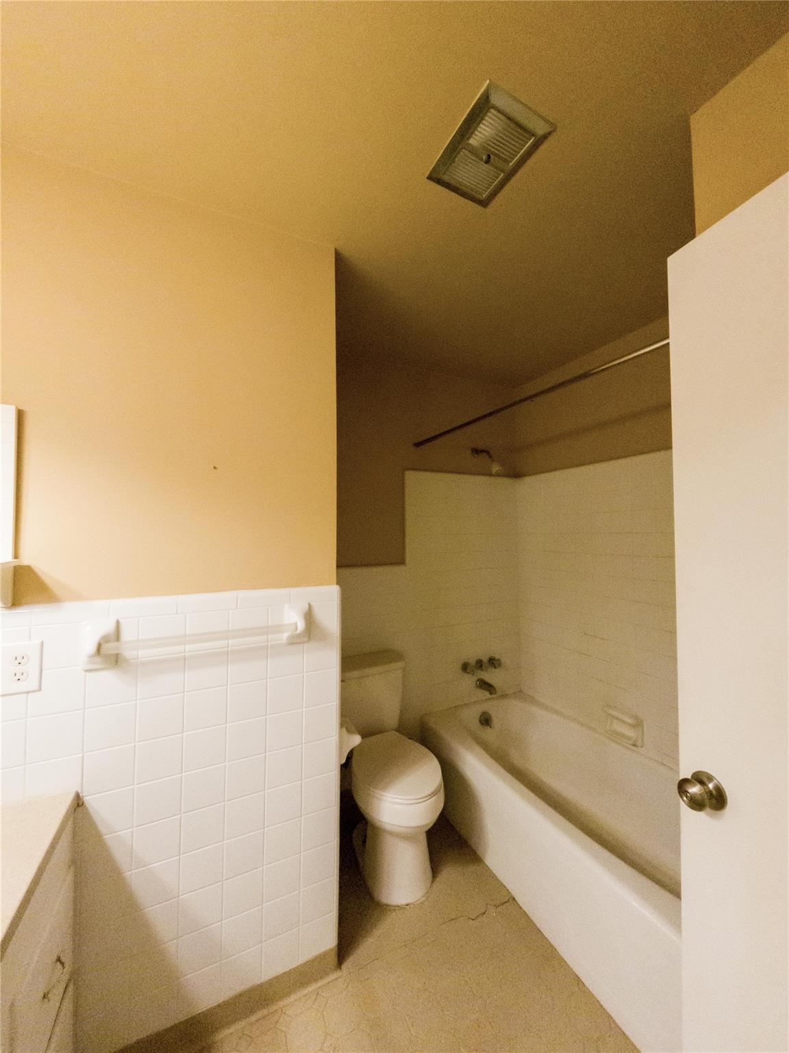 4910 Lakeview Road Charlotte, NC 28216 - Photo 17 of 26 a white toilet sitting next to a bathroom sink