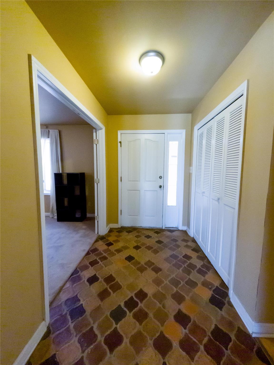 4910 Lakeview Road Charlotte, NC 28216 - Photo 22 of 26 a bedroom with a bed and a walk in closet