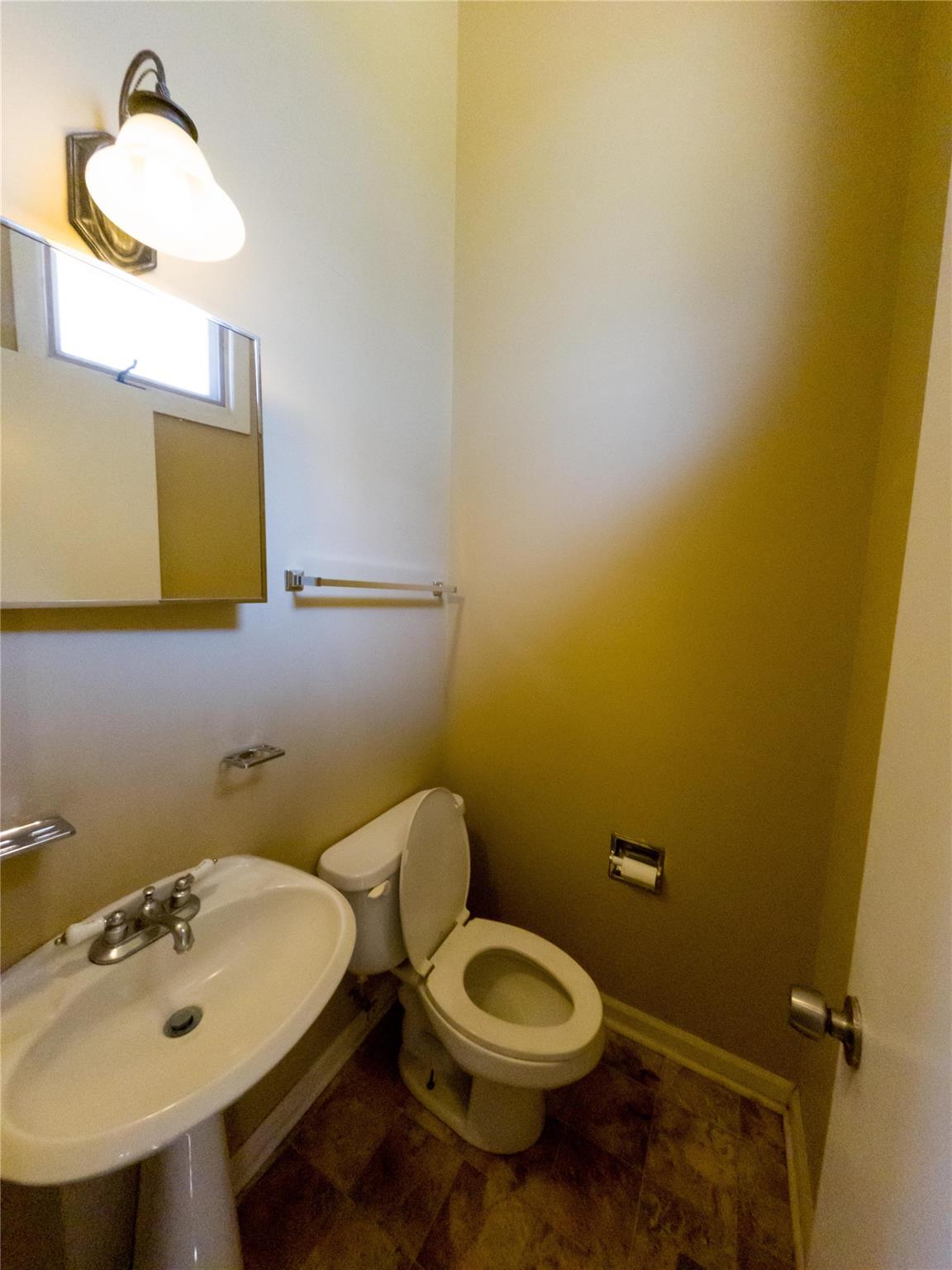 4910 Lakeview Road Charlotte, NC 28216 - Photo 25 of 26 a bathroom with a sink and a toilet