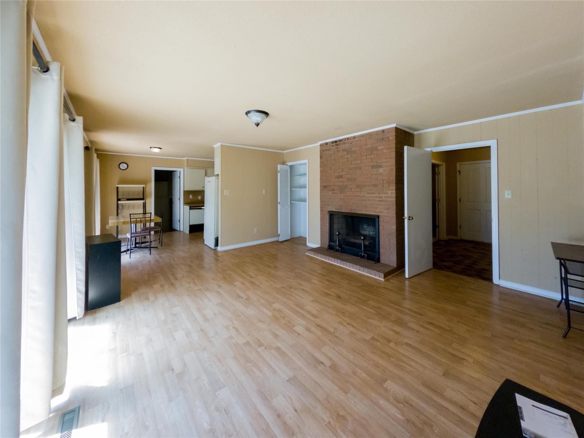 4910 Lakeview Road Charlotte, NC 28216 - Photo 10 of 26 a view of a livingroom with furniture and a fireplace