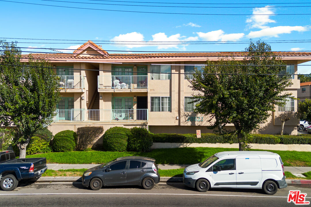 a view of a car parked in front of a house
