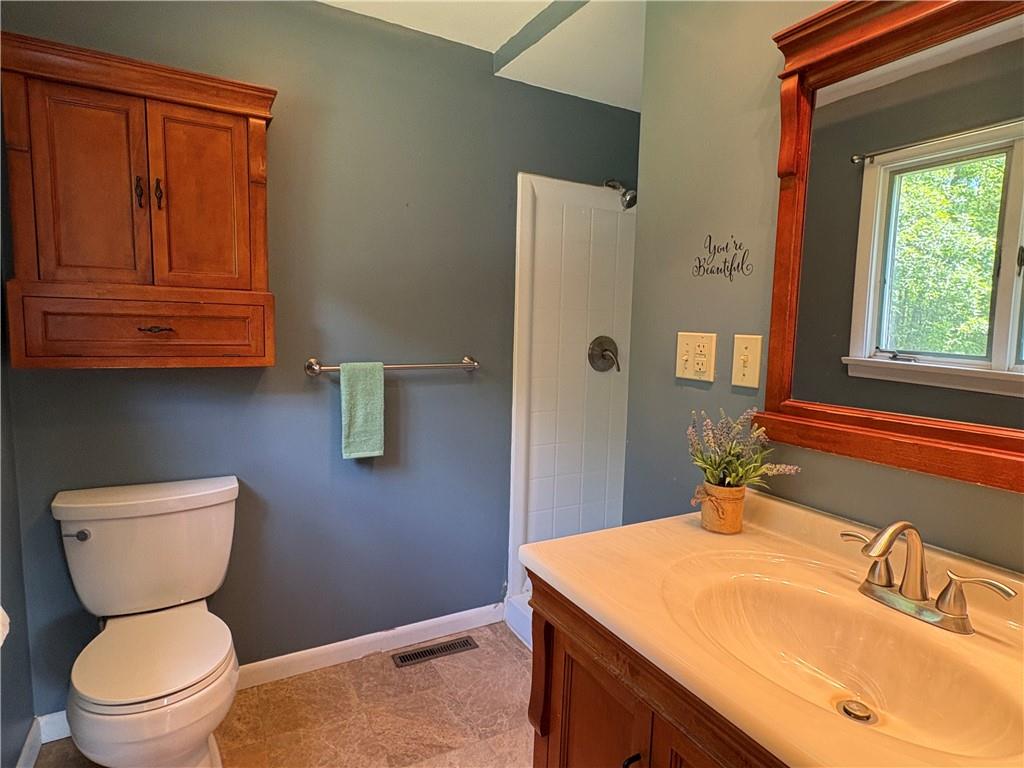 320 Cherry Hill Road Greenville, PA 16125 - Photo 20 of 38 a bathroom with a toilet sink and mirror