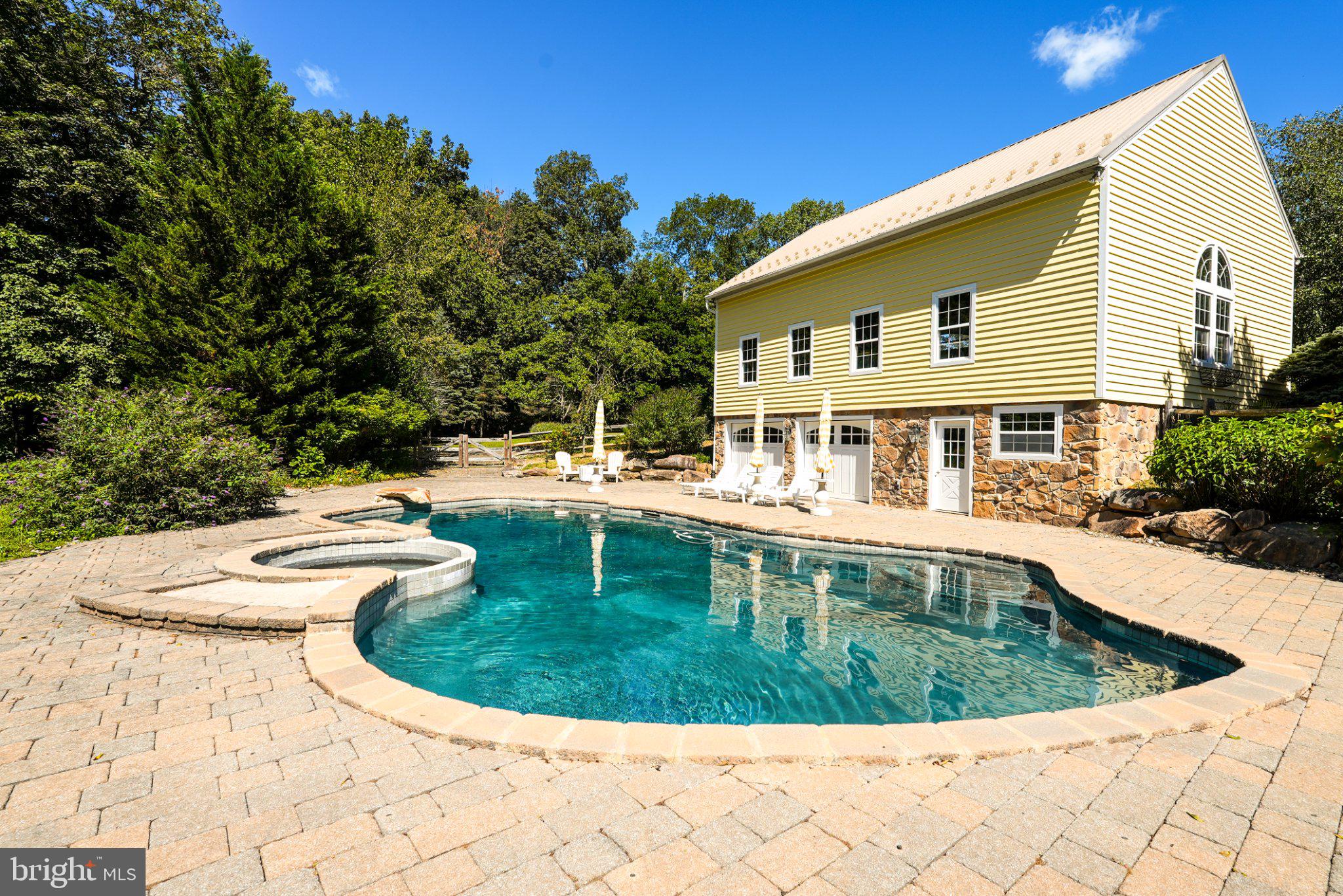 928 Swamp Road Furlong, PA 18925 - Photo 18 of 85 Serene poolside retreat in nature.
