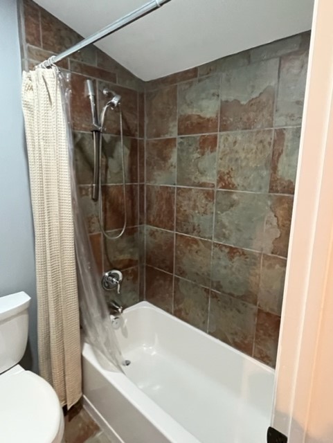 2215 Post Road, Unit 2044 Austin, TX 78704 - Photo 21 of 34 Earthy slate tiles surround a classic soaking tub setup.