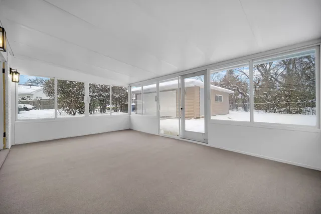 a view of an empty room with a large window