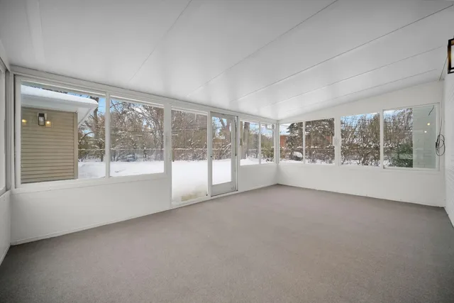 a view of an empty room with a window