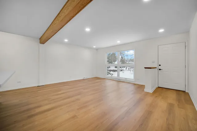 a view of a livingroom with wooden floor