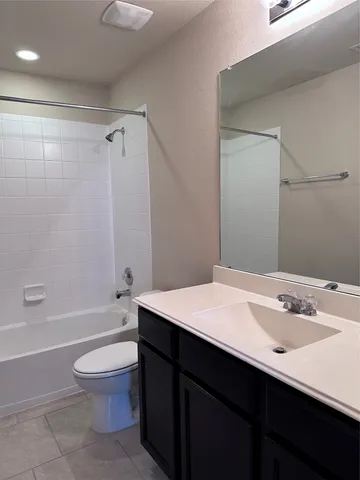 a bathroom with a sink a toilet and a bathtub