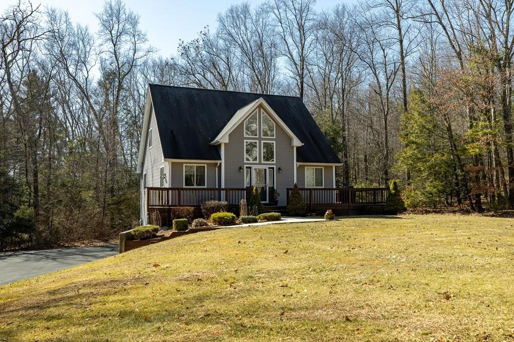 64 Leno Road Holland, MA 01521 - Photo 1 of 36 a front view of a house with a yard