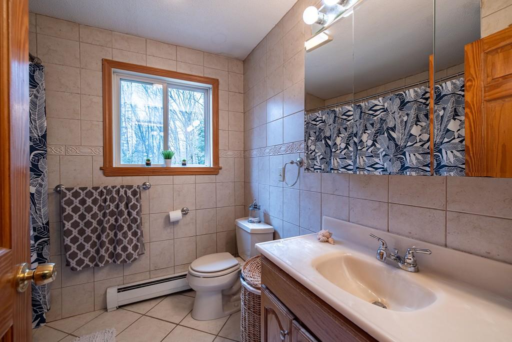 64 Leno Road Holland, MA 01521 - Photo 22 of 36 a bathroom with a sink toilet and window