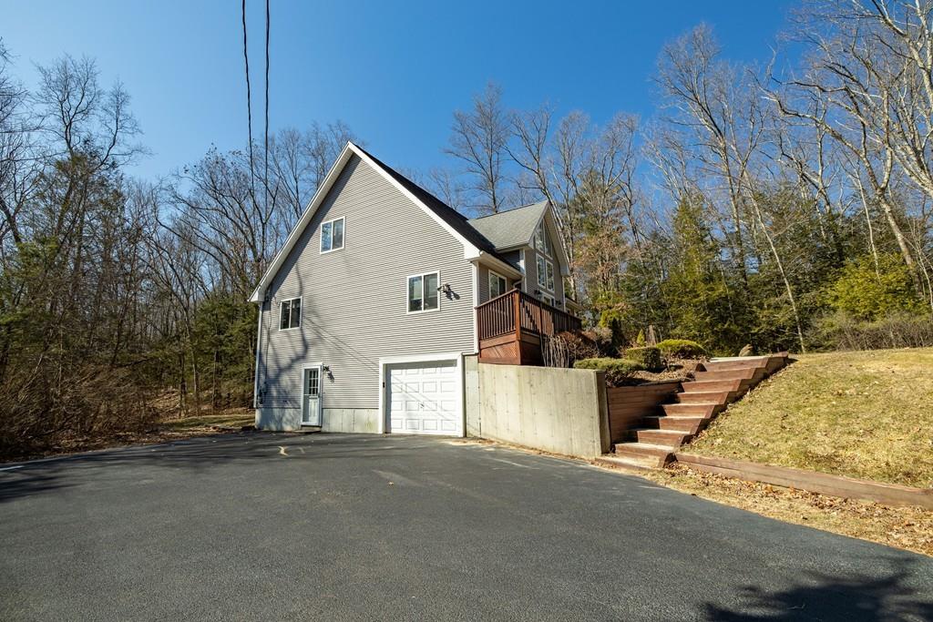 64 Leno Road Holland, MA 01521 - Photo 6 of 36 a view of a house with a street