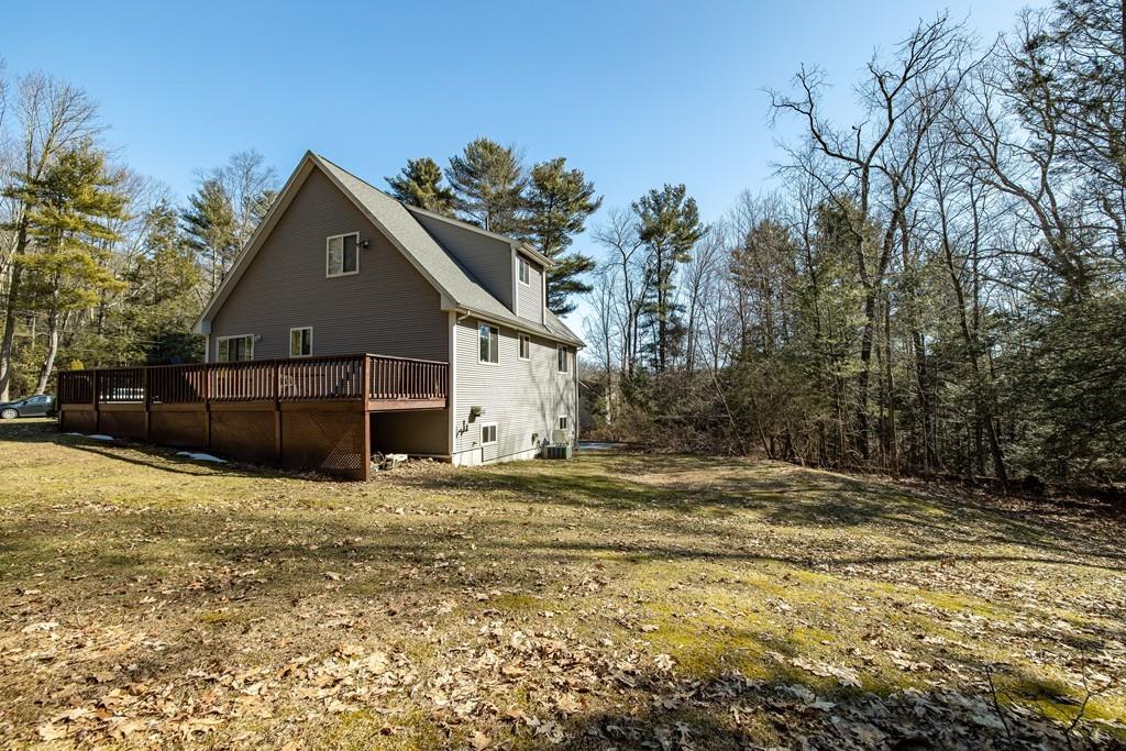 64 Leno Road Holland, MA 01521 - Photo 7 of 36 a view of a house with a covered yard