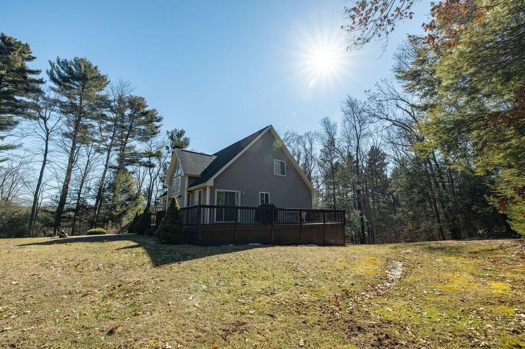 64 Leno Road Holland, MA 01521 - Photo 8 of 36 a front view of a house with a yard