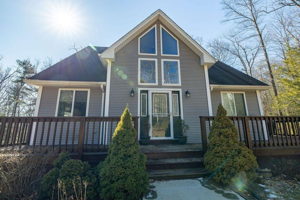 64 Leno Road Holland, MA 01521 - Photo 9 of 36 a front view of a house with garden