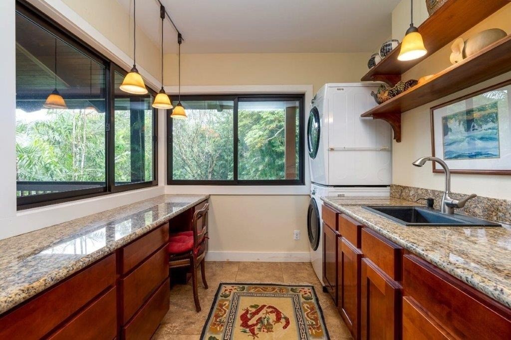 4318 Punee Road Koloa, HI 96756 - Photo 13 of 23 a kitchen with a sink and large windows