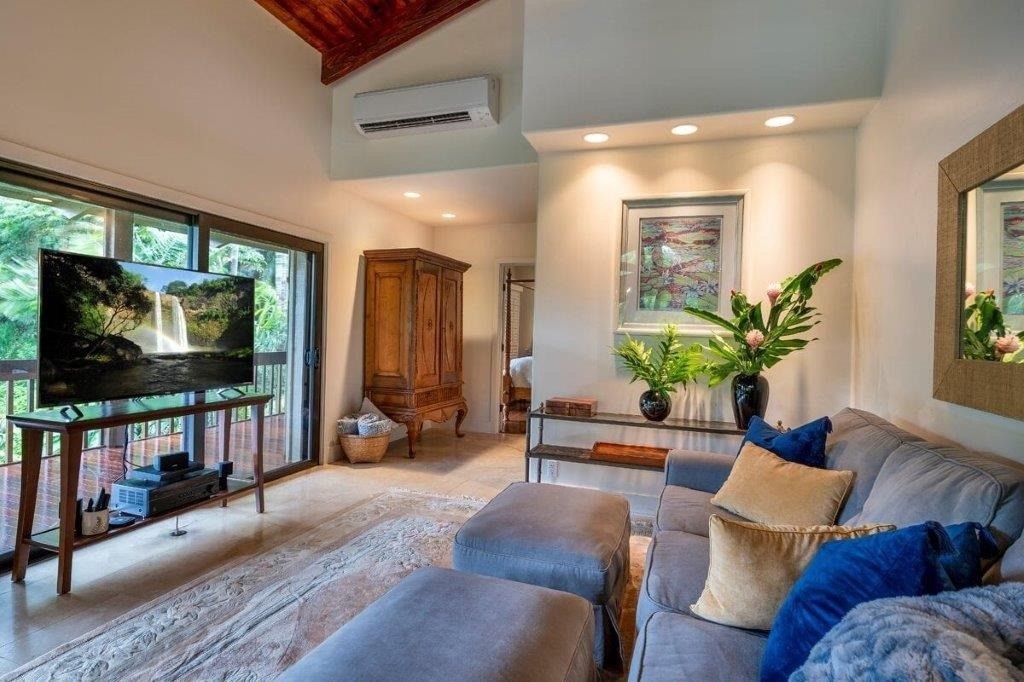 4318 Punee Road Koloa, HI 96756 - Photo 4 of 23 a living room with furniture and a flat screen tv