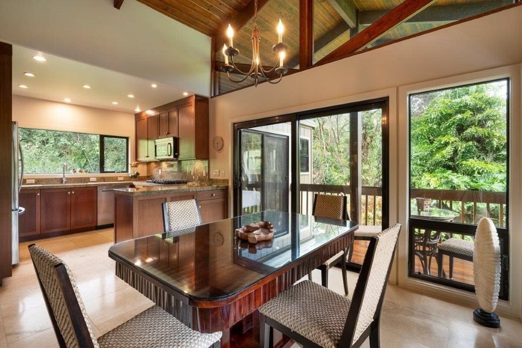 4318 Punee Road Koloa, HI 96756 - Photo 7 of 23 a dining room with furniture a chandelier and wooden floor