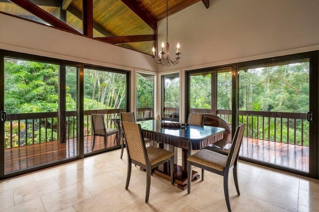 4318 Punee Road Koloa, HI 96756 - Photo 8 of 23 a view of a dining room with furniture large windows and wooden floor