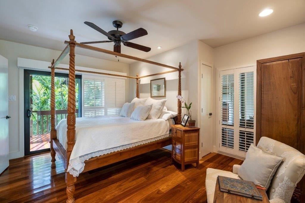 4318 Punee Road Koloa, HI 96756 - Photo 9 of 23 a bedroom with a bed and wooden floor