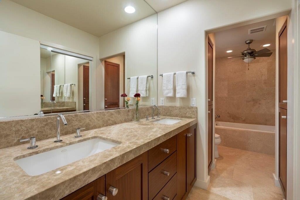 4318 Punee Road Koloa, HI 96756 - Photo 10 of 23 a bathroom with a granite countertop sink a mirror and a shower