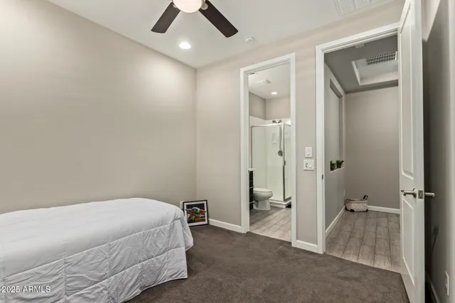 a living room with furniture and a chair