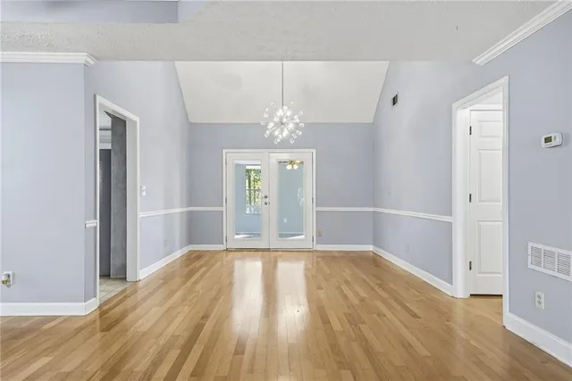 a view of a room with window and wooden floor