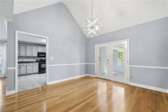 a view of a kitchen with wooden floor and a kitchen