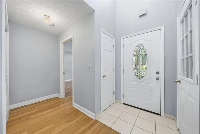 an empty room with closet and a window