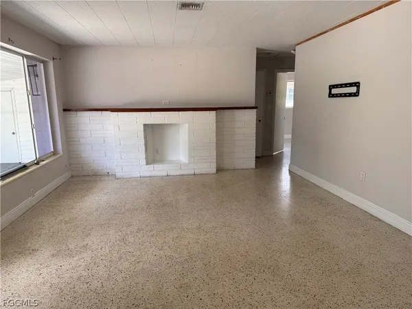 a view of an empty room with a window