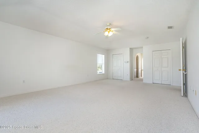 an empty room with a bathroom