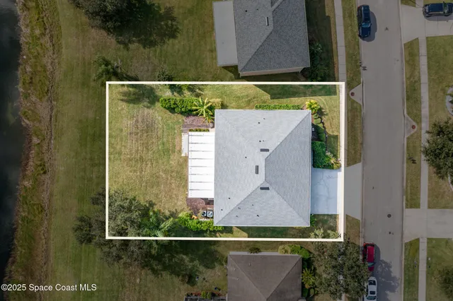 a view of a swimming pool with a patio and outdoor space