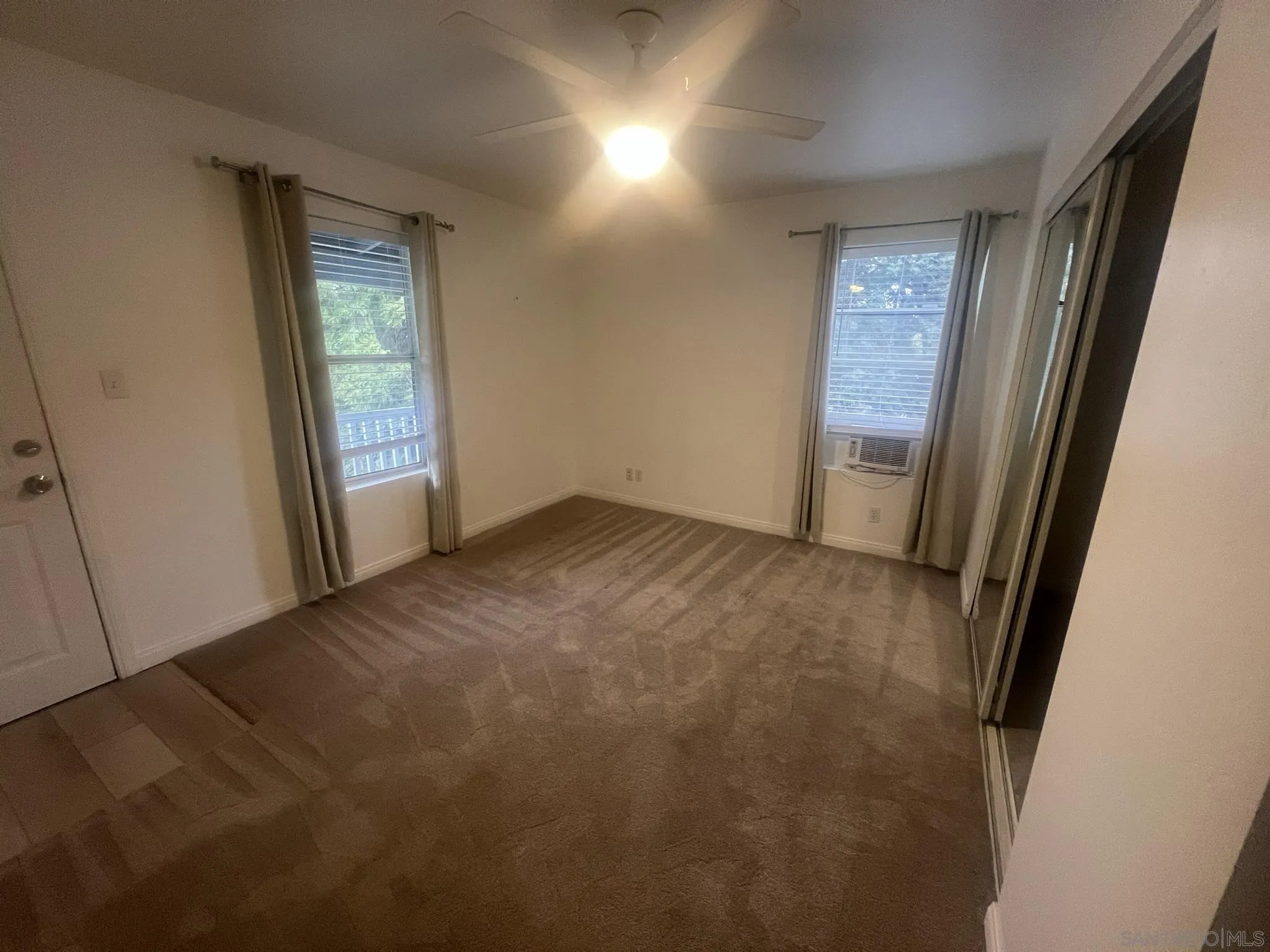 1927 3rd Street Julian, CA 92036 - Photo 3 of 11 an empty room with windows and closet