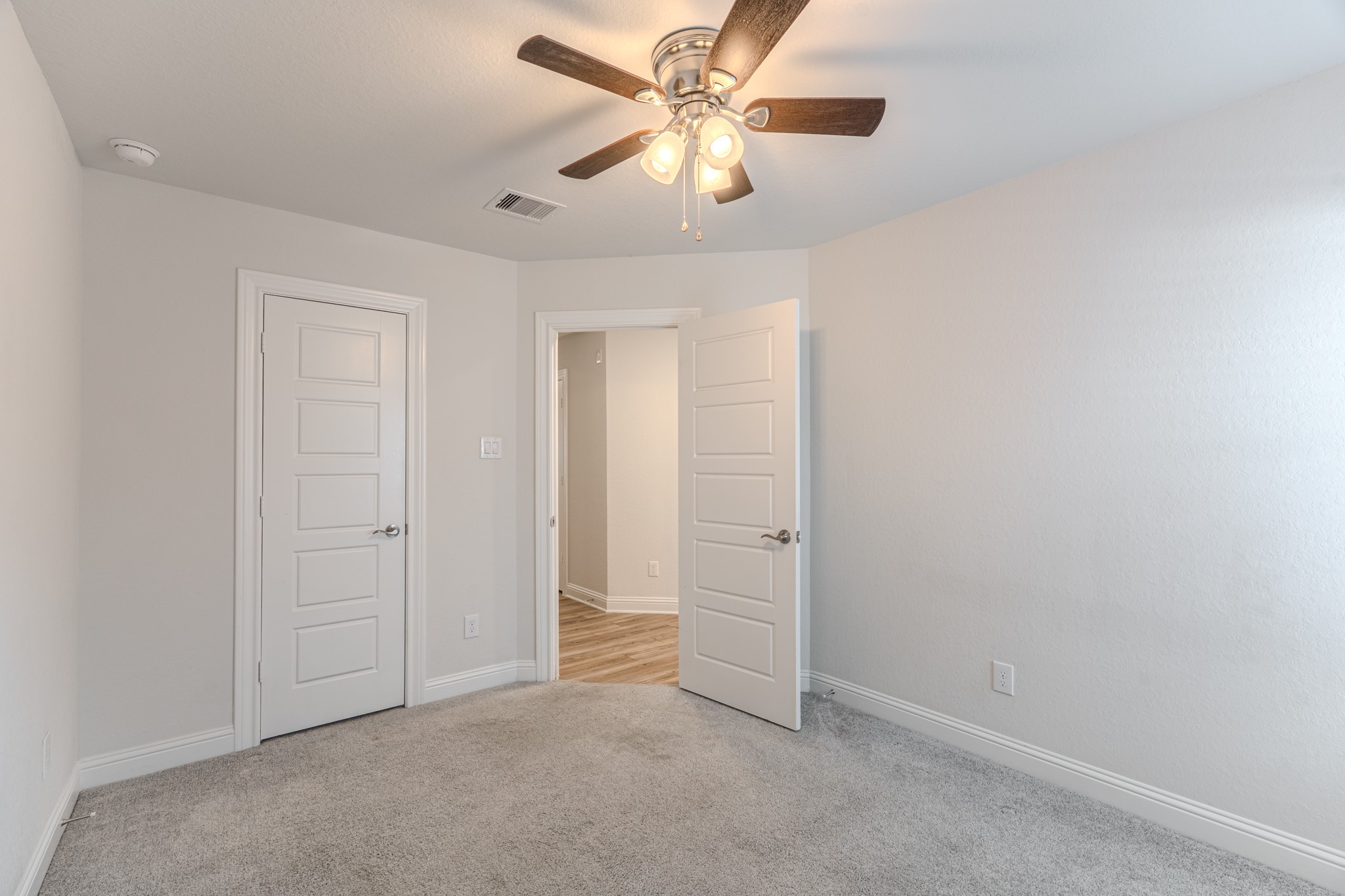 9840 Sweet Flag Court Conroe, TX 77385 - Photo 48 of 50 Each bedroom is thoughtfully placed to provide privacy while maintaining a cohesive and functional floor plan.