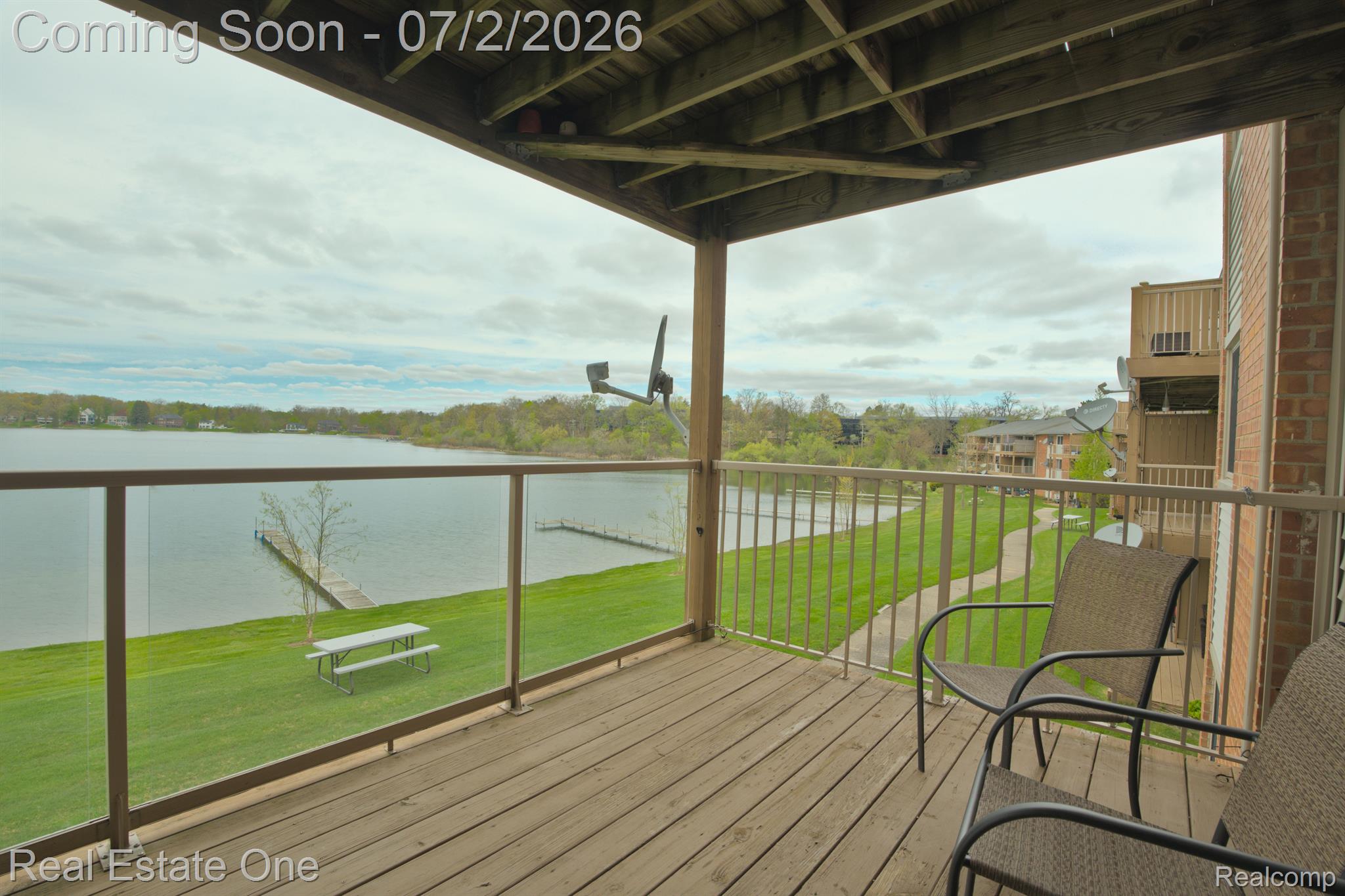 1944 Klingensmith Road, Unit 41 Bloomfield Hills, MI 48302 - Photo 3 of 25 Deck off Family Room with view of lake